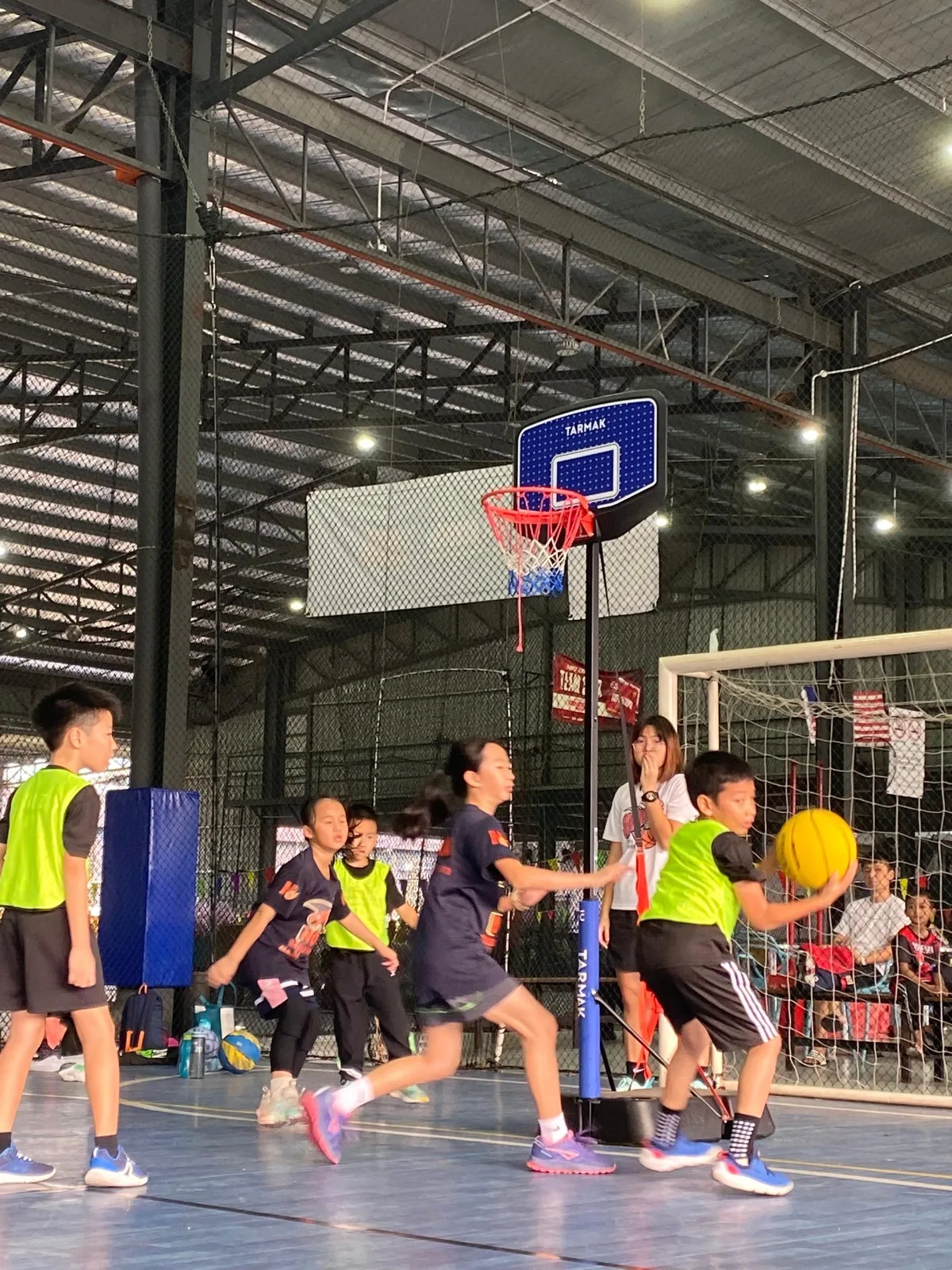 Kids ages 8–11 playing basketball